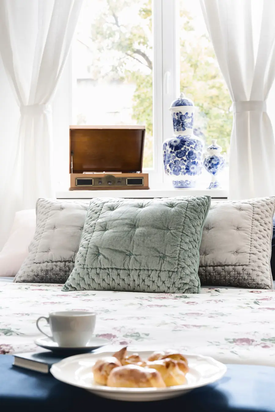 Soft pillows by a bright window